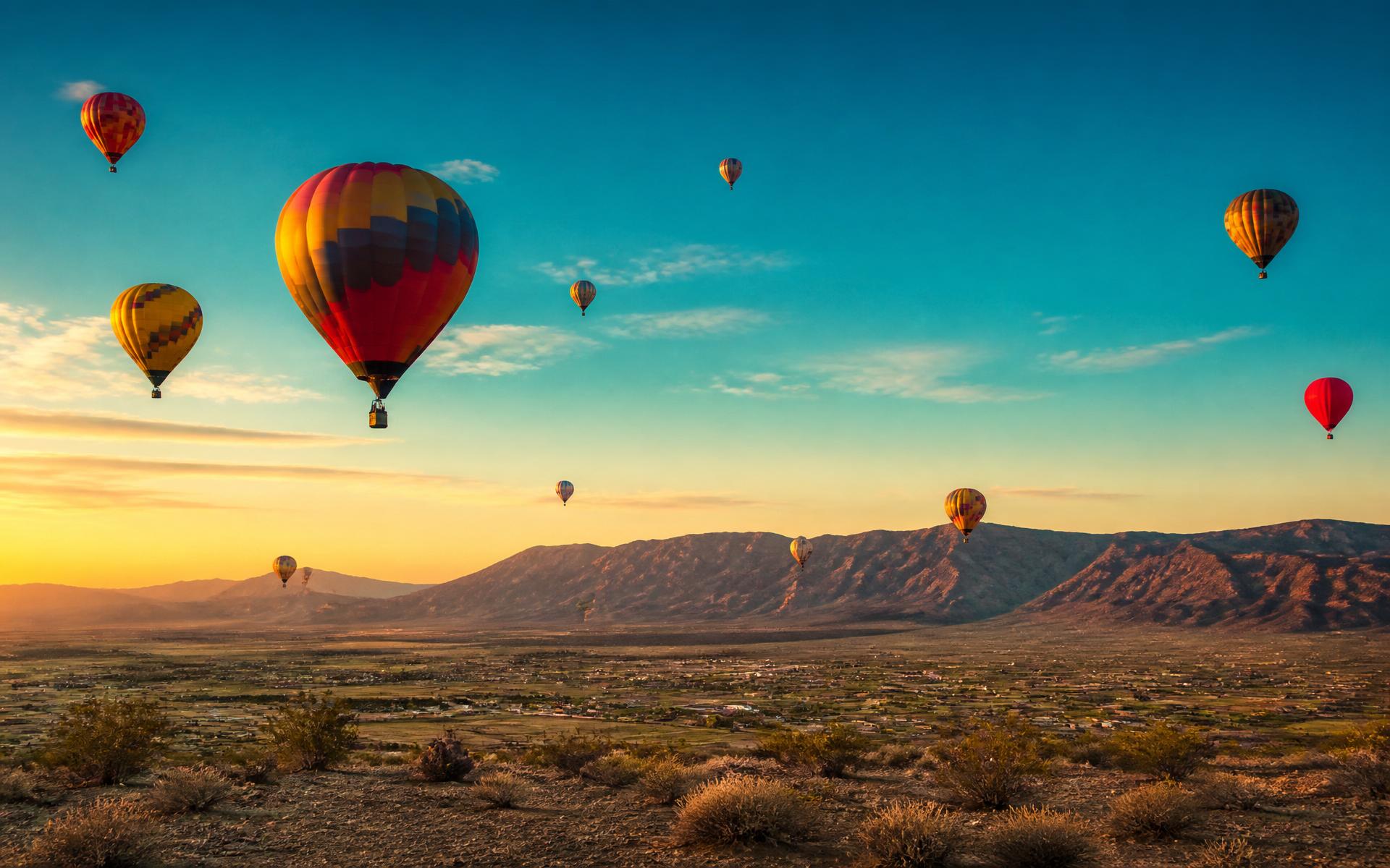 Hot air balloons rising over the Pahrump Valley at sunrise